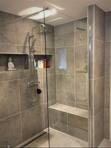 Completed bathroom renovation by Optimum Contractors